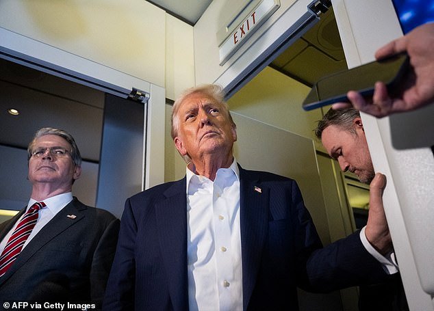 103344261-15230623-US_Treasury_Secretary_Scott_Bessent_L_US_President_Donald_Trump_-a-14_1761571470234.jpg