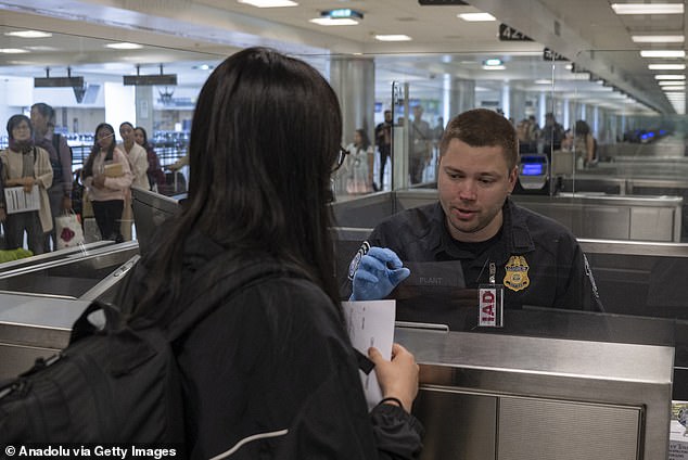 104253251-15333167-The_Trump_administration_is_to_launch_a_sweeping_immigration_sec-a-5_1764294729047.jpg