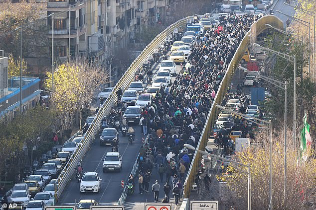 105157131-15438017-A_large_group_of_protesters_in_Tehran_on_December_29_The_unrest_-a-23_1767698437585.jpg