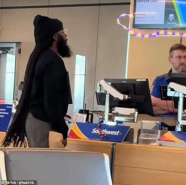 105170045-15428159-An_irate_passenger_was_caught_on_camera_threatening_a_Southwest_-a-1_1767335411398.jpg