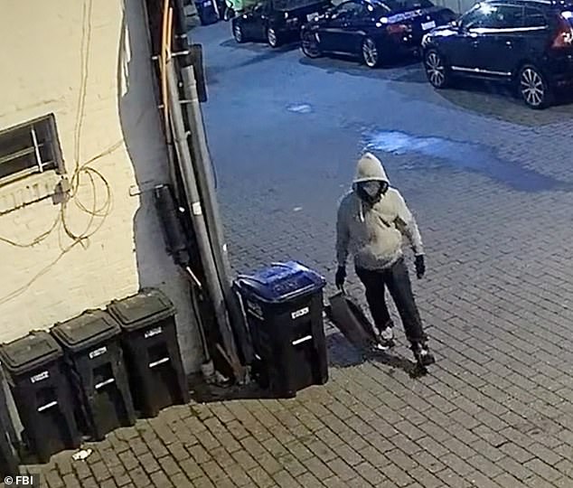105194505-15429055-A_man_accused_of_planting_pipe_bombs_outside_the_headquarters_of-a-6_1767408895385.jpg