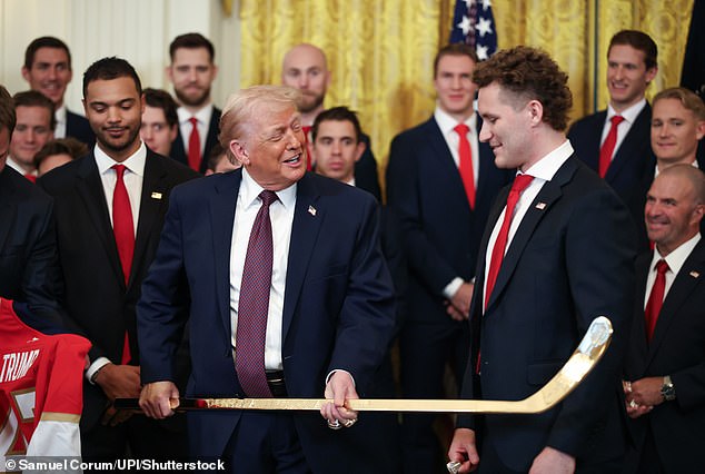 105558869-15468639-President_Donald_Trump_speaks_with_Florida_Panthers_player_Matth-a-55_1768518595444.jpg