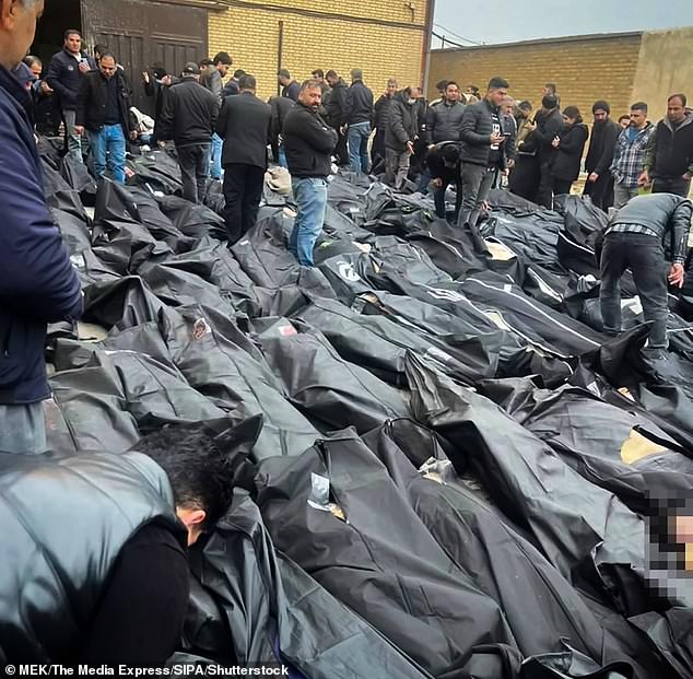 105783503-15495523-Families_and_residents_gather_at_the_Kahrizak_Coroner_s_Office_c-a-40_1769309359320.jpg