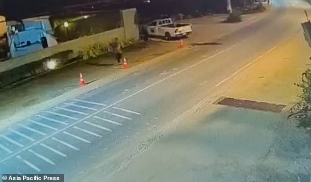 107283657-15663727-CCTV_shows_Jordan_top_right_running_erratically_along_the_road_s-m-16_1773990430076.jpg