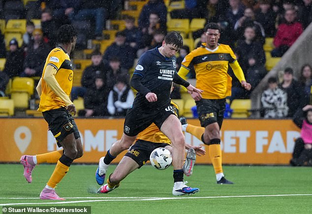 107317339-15667213-Mikey_Moore_was_scythed_down_by_Cammy_Kerr_but_Livingston_ended_-a-51_1774109393855.jpg