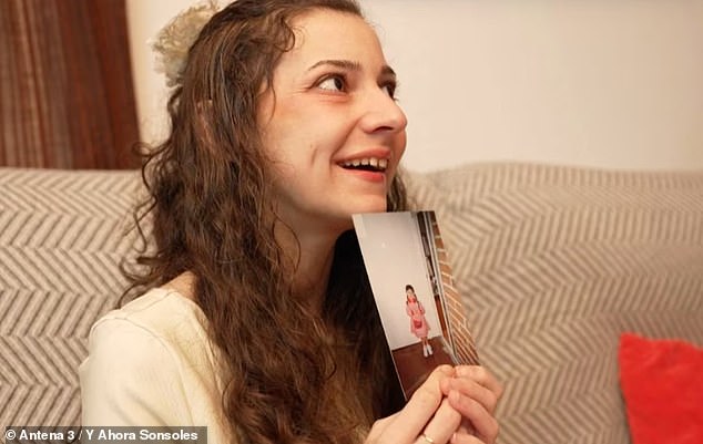 107464643-15681815-Noelia_smiles_as_she_holds_up_a_picture_from_her_childhood_taken-a-15_1774618937590.jpg