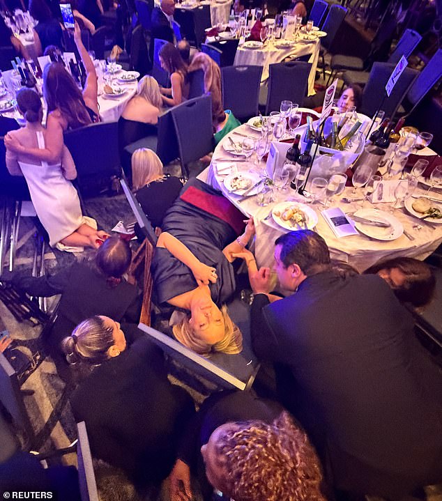 108171757-15767475-Several_gunshots_rang_out_as_panicked_attendees_immediately_duck-a-3_1777245542508.jpg