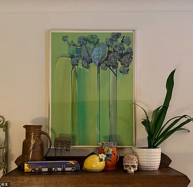 108421751-15794991-Lydia_Kauppi_37_of_Minneapolis_thrifted_a_Jerry_Rudquist_paintin-a-32_1778098872162.jpg