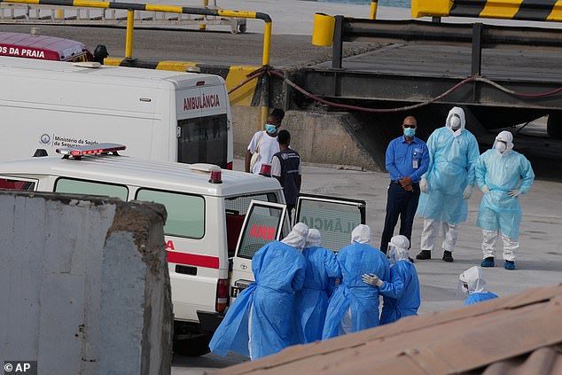 108448339-15800211-Health_workers_in_protective_gear_evacuate_patients_from_the_MV_-a-27_1778200080954.jpg
