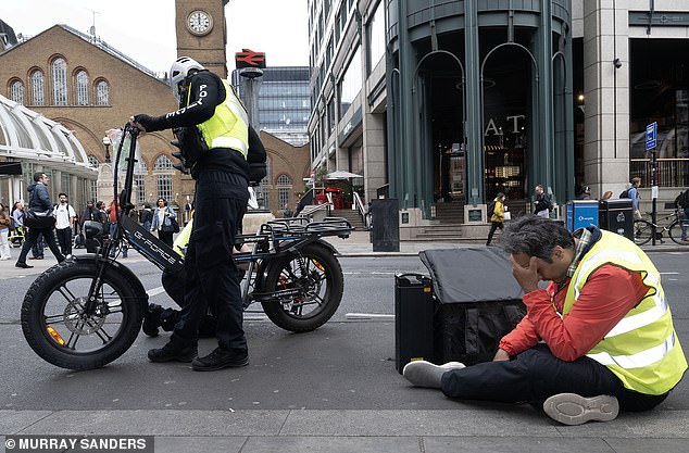 108508313-15806065-Amazon_delivery_man_Babak_Fordaliah_34_sits_on_the_floor_head_in-a-9_1778446699716.jpg
