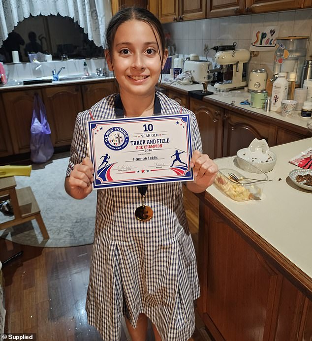 108621399-15816061-Hannah_Teklic_proudly_showed_off_her_certificate_for_become_scho-m-8_1778806686922.jpg
