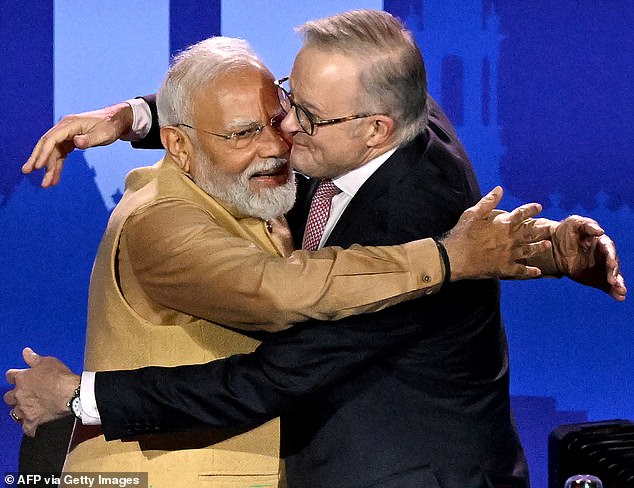 109925197-15967105-Prime_Minister_Anthony_Albanese_gives_Indian_PM_Narendra_Modi_a_-m-4_1783646344620.jpg