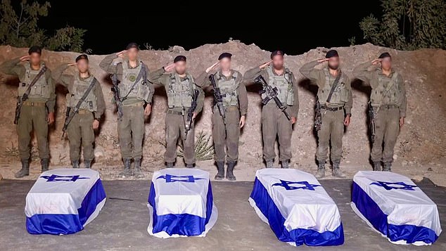 102984469-15205071-IDF_troops_receive_remains_of_killed_hostages_at_official_ceremo-a-29_1760814187112.jpg