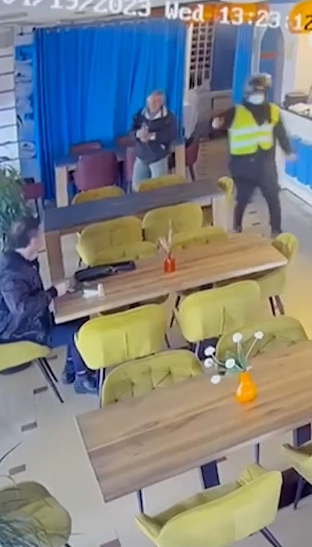 88985315-15682145-Ardian_Nikulaj_was_sitting_at_a_table_when_a_man_pulled_out_a_gu-a-1_1774544691841.jpg