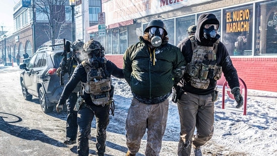 TOPSHOT-US-IMMIGRATION-ICE-SHOOTING-6_1769339099694_1769339111812.jpg